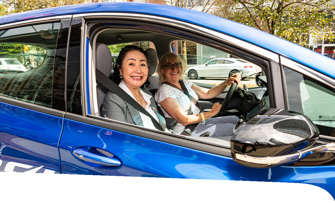 Two women in an electric car