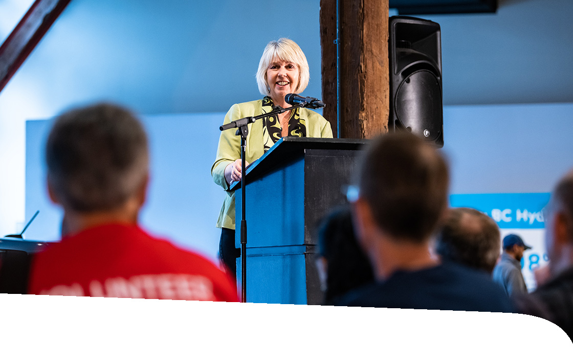 A woman speaks at an info session